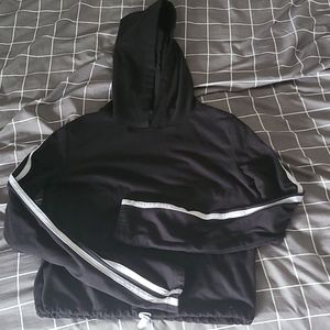 Size:youth small  From:Feathers color:black, w/ white stripes on sleeves